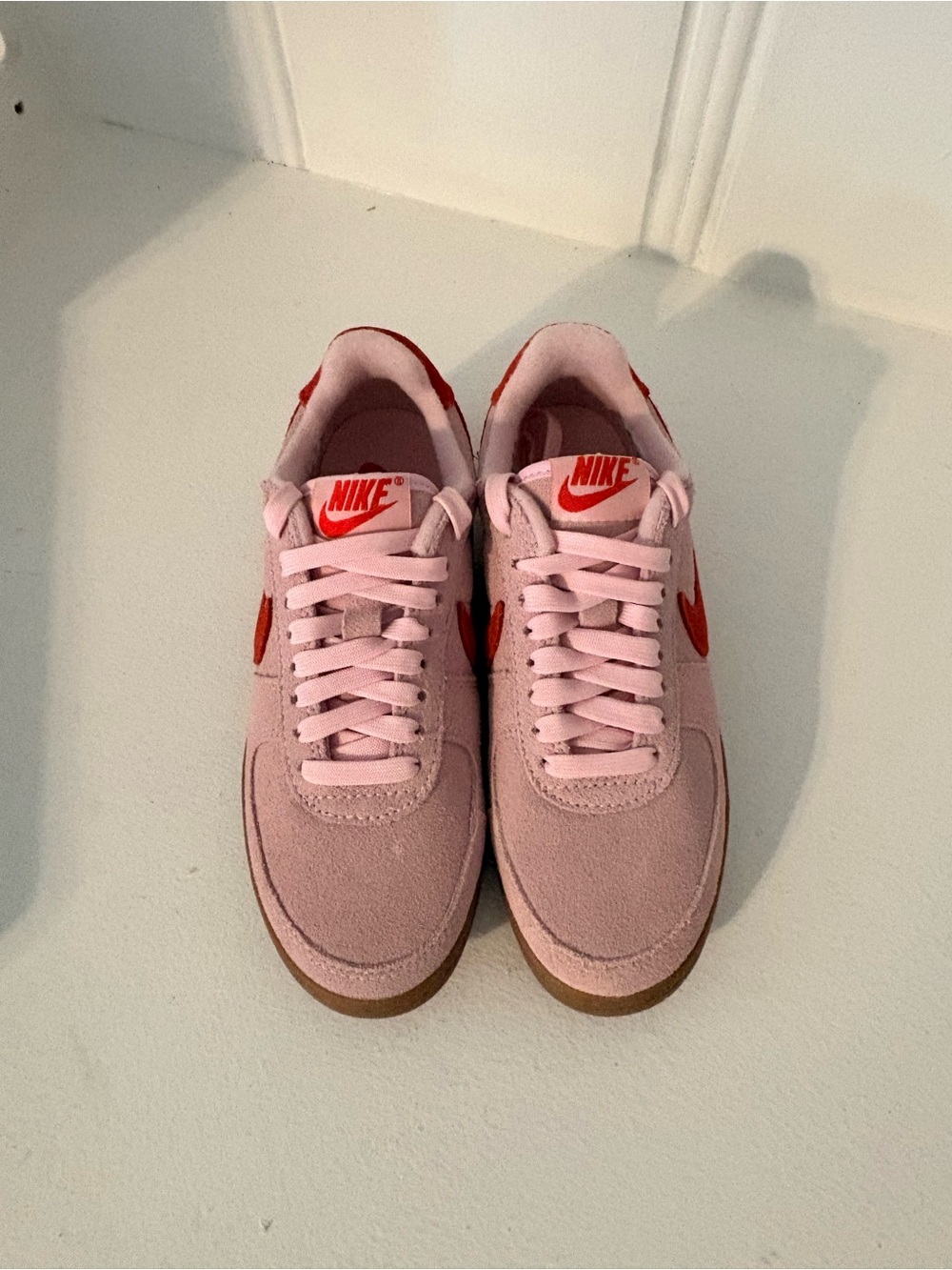 Nike Women’s Light Pink Suede Sneakers with Red Swoosh